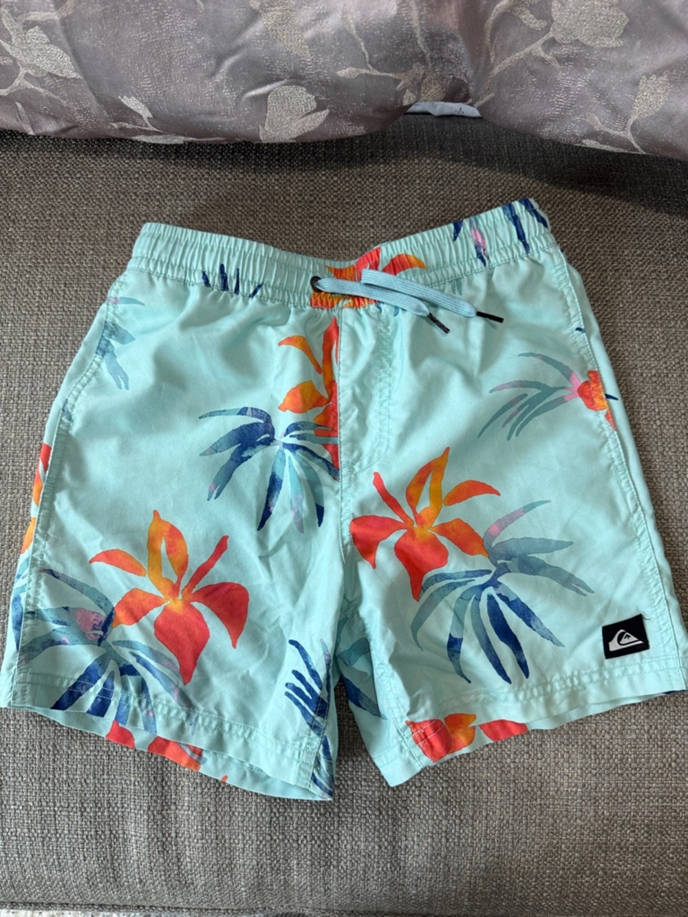 Quiksilver Aqua Floral Board Shorts with Red-Orange Blooms